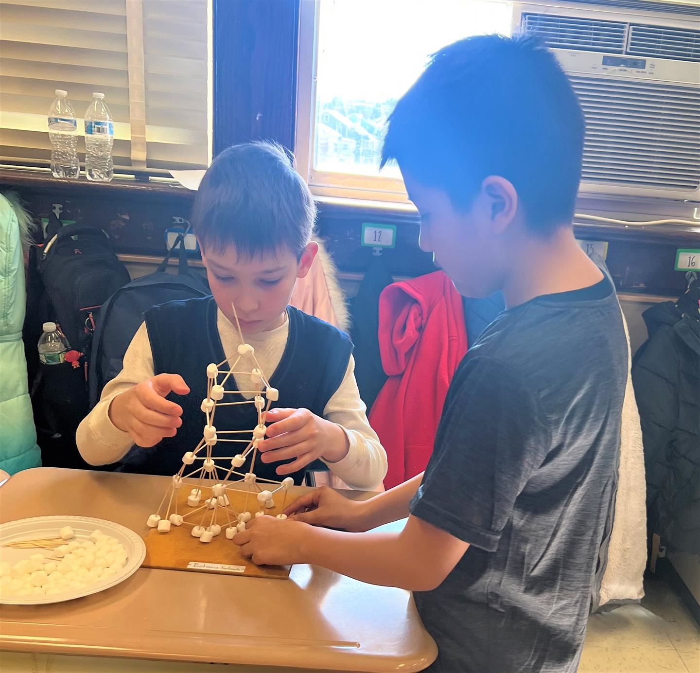  Students build a tower with 100 toothpicks and marshmallows